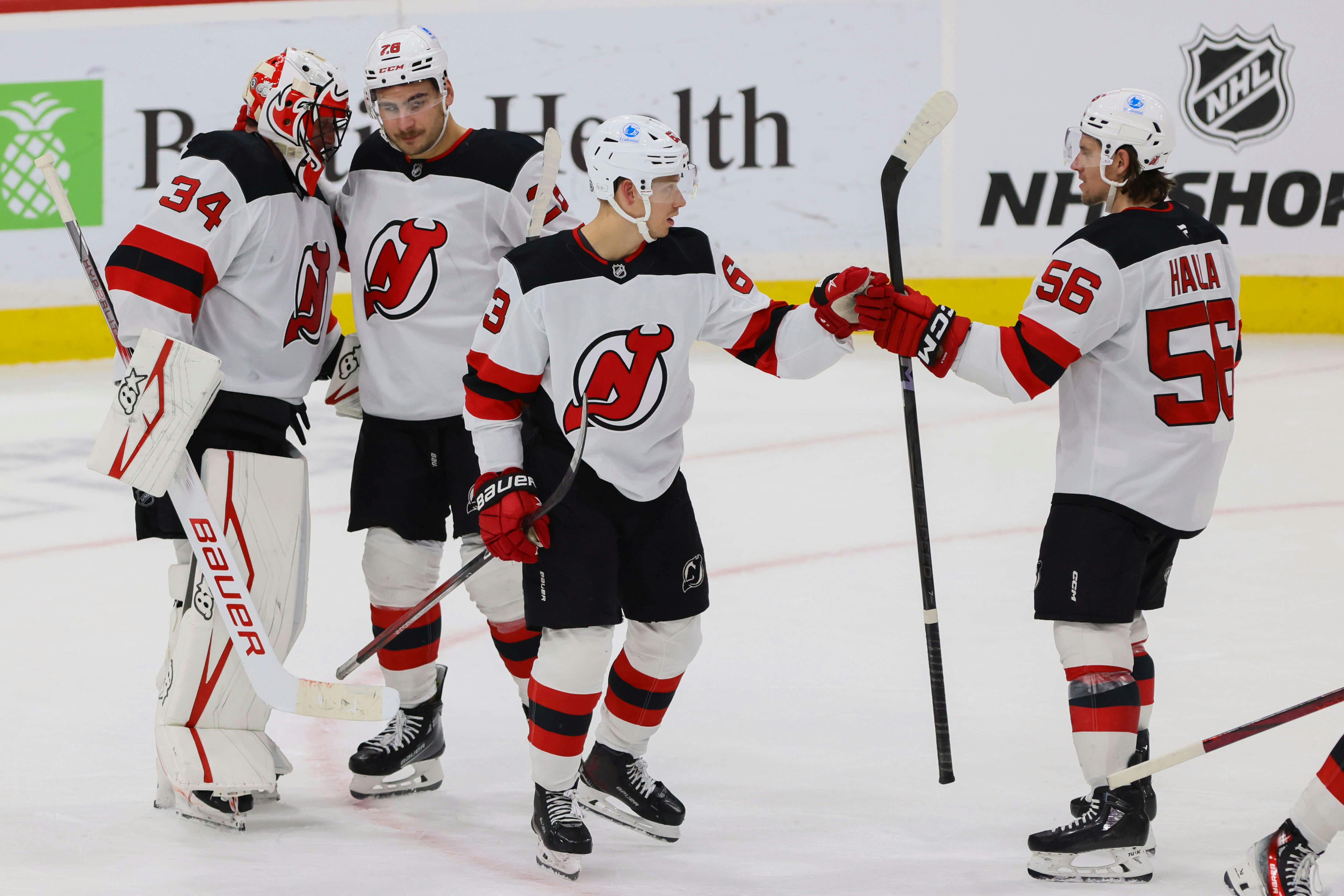 New Jersey Devils left wing Jesper Bratt (63) celebrates with left wing Erik Haula (56) after the game against the Florida Panthers at Amerant Bank Arena. Mandatory Credit: Sam Navarro-Imagn Images