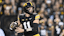 Iowa Hawkeyes quarterback Mark Gronowski (11) prepares to throw a pass against the Penn State Nittany Lions.
