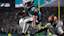 Philadelphia Eagles running back Saquon Barkley (26) leaps with the ball against the Washington Commanders.