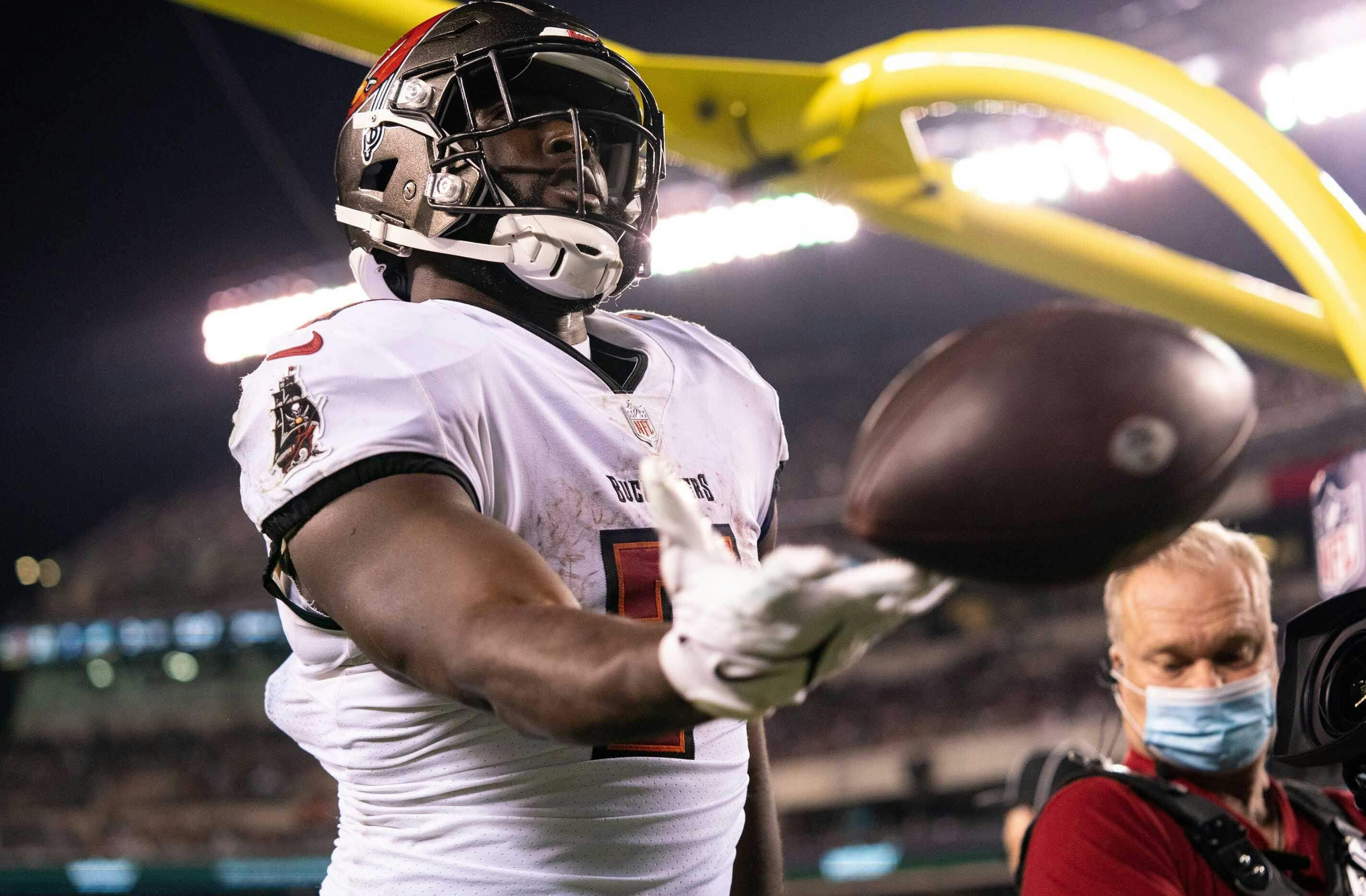 Buccaneers running back Leonard Fournette (7) tosses the ball into the stands after scoring a touchdown Philadelphia Eagles during the third quarter at Lincoln Financial Field.