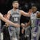 Sacramento Kings guard Kevin Huerter (9), forward Domantas Sabonis (10), and guard De'Aaron Fox (5) high-five each other during a time out in the second half against the Portland Trail Blazers at Moda Center.