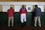 Michael Freeze, center, is not a real jockey, but that didn't stop him from dressing the part and placing a bet ahead of the Kentucky Derby at Churchill Downs on May 4, 2019