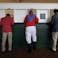 Michael Freeze, center, is not a real jockey, but that didn't stop him from dressing the part and placing a bet ahead of the Kentucky Derby at Churchill Downs on May 4, 2019