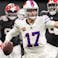 Buffalo Bills quarterback Josh Allen (17) carries the ball against the Atlanta Falcons during the second half of a game at Mercedes-Benz Stadium.