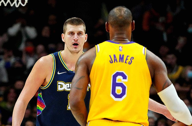 Los Angeles Lakers forward LeBron James and Denver Nuggets center Nikola Jokic in NBA action.