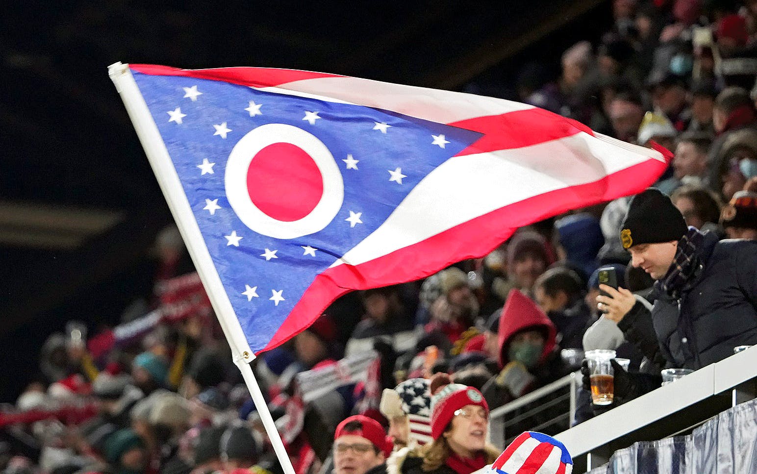 A United States fan waves an Ohio Flag during the second half of the 2022 FIFA World Cup Qualifying game against El Salvador at Lower.com Field in Columbus, Ohio on January 27, 2022. Ceb Usmnt Kwr 45