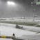 The Lambeau Field field crew in Green Bay, Wisconsin, removes snow before a game between the Green Bay Packers and Tennessee Titans on Dec. 27, 2020.
