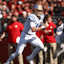 UCLA Bruins quarterback Ethan Garbers (4) rushes for a touchdown  against the Rutgers Scarlet Knights.
