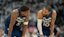 Minnesota Timberwolves guard Anthony Edwards (5) looks on with Minnesota Timberwolves guard Mike Conley (10).