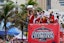 Florida Panthers center Anton Lundell (left) hoists the cup during the Stanley Cup victory parade and celebration. Mandatory Credit: Sam Navarro-Imagn Images