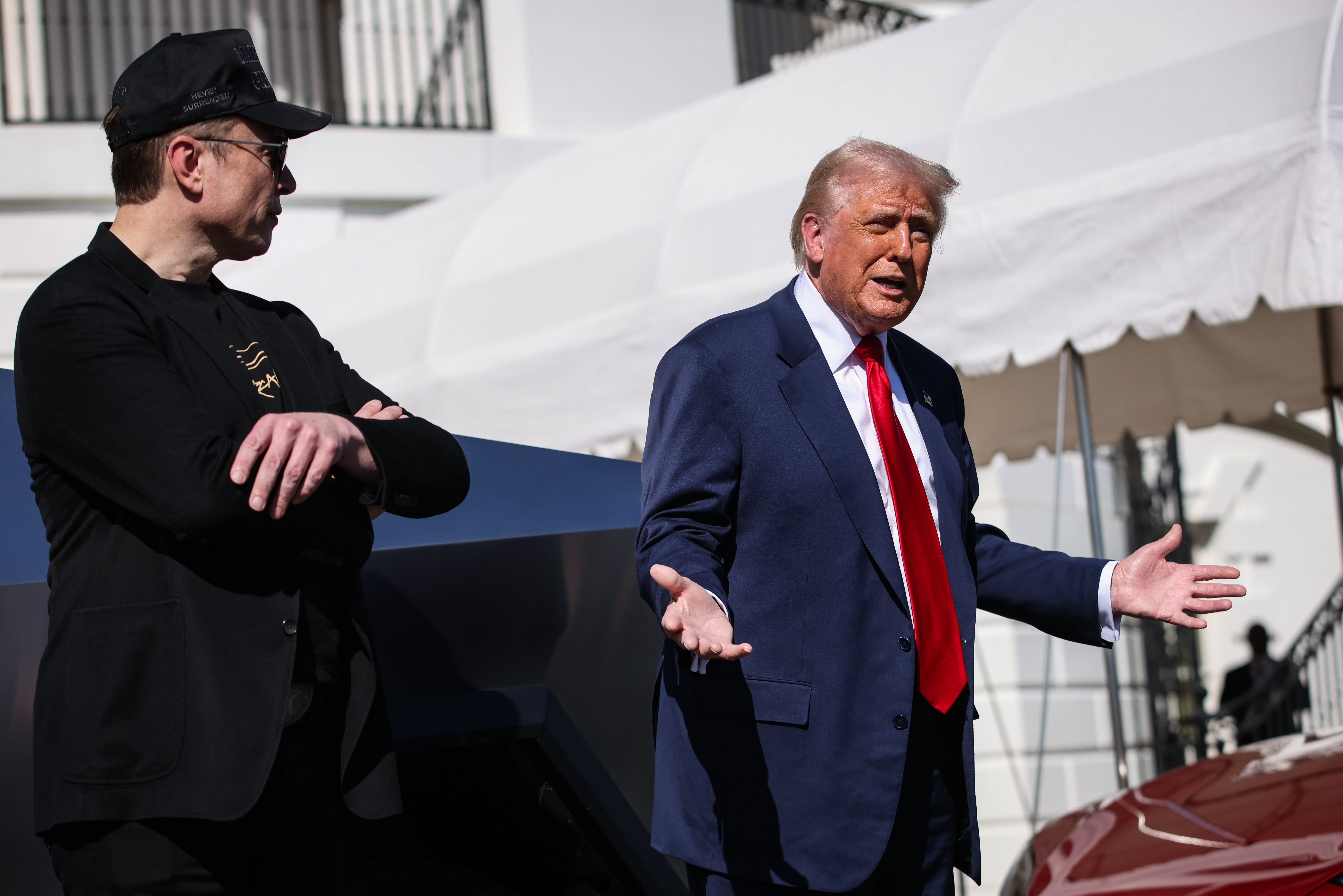 President Donald Trump speaks in front of a group of Tesla vehicles with Elon Musk, Tesla CEO and Senior Advisor to the President of the United States, on the South Lawn of the White House in Washington, D.C. on March 11, 2025. 