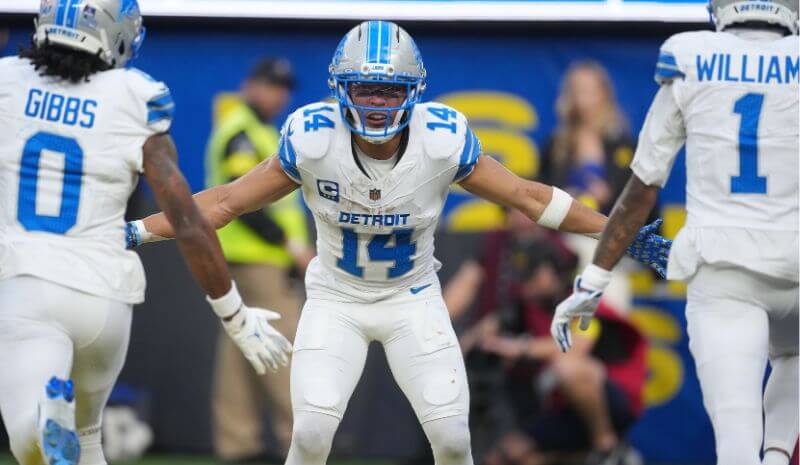 Detroit Lions running back Jahmyr Gibbs (0), Detroit Lions wide receiver Amon-Ra St. Brown (14) and Detroit Lions wide receiver Jameson Williams (1) celebrate.