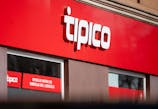 The logo of Tipico, a sports betting provider, is displayed above the entrance to a branch of the betting shop.