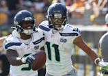 Seattle Seahawks running back Kenneth Walker III (9) celebrates his touchdown with wide receiver Jaxon Smith-Njigba (11) against the Pittsburgh Steelers during the fourth quarter at Acrisure Stadium. Charles LeClaire-Imagn Images