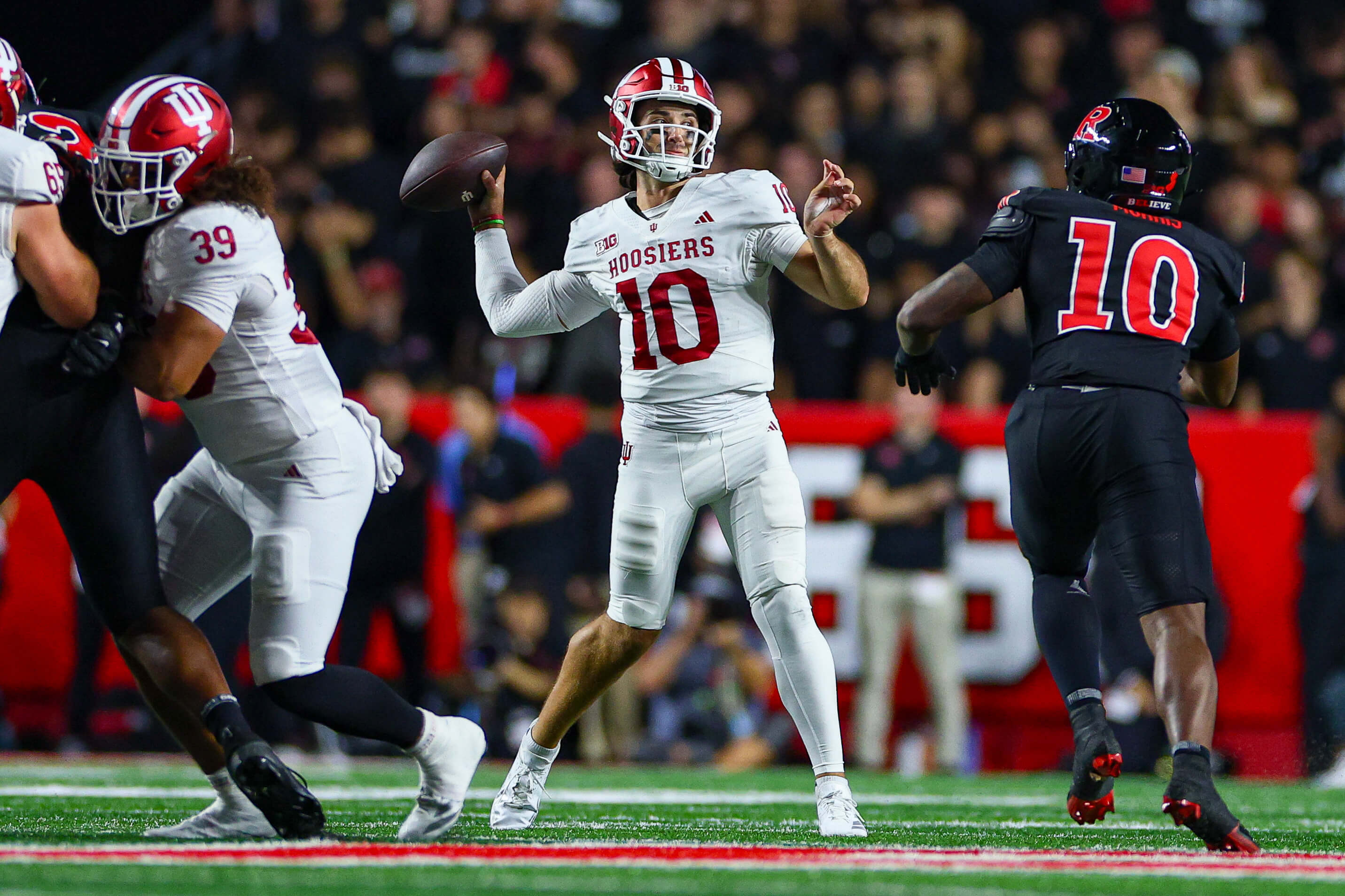 College football AI predictions, Indiana Hoosiers quarterback Josh Hoover (10) throws the ball.