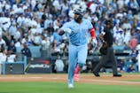Toronto Blue Jays first baseman Vladimir Guerrero Jr. (27) celebrates after hitting a home run during the first inning against the Los Angeles Dodgers in Game 5 of the 2025 MLB World Series at Dodger Stadium. Kiyoshi Mio-Imagn Images