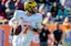 North quarterback Shea Patterson of Michigan (7) rolls out during the 2020 Senior Bowl college football game at Ladd-Peebles Stadium.