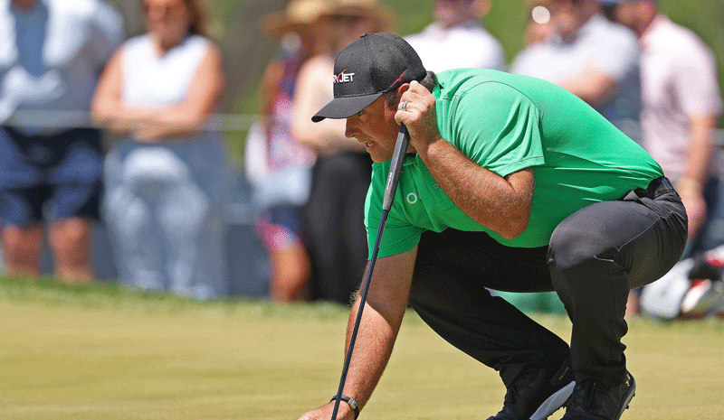 U.S. Open long-shot predictions, Patrick Reed prepares to putt.