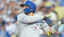 Toronto Blue Jays shortstop Bo Bichette (11) hits a double during the second inning against the Los Angeles Dodgers at Dodger Stadium.