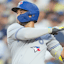 Toronto Blue Jays shortstop Bo Bichette (11) hits a double during the second inning against the Los Angeles Dodgers at Dodger Stadium.