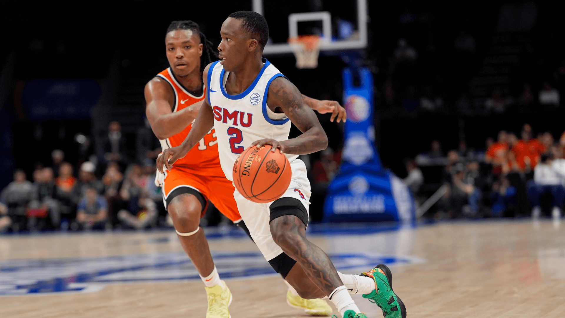 Southern Methodist Mustangs guard Boopie Miller (2) drives to the basket against Syracuse Orange forward Jyare Davis (13).