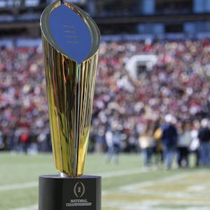 Detailed view of the National Championship trophy on the field during a game between the Georgia Bulldogs and Georgia Tech Yellow Jackets in the second quarter at Bobby Dodd Stadium.