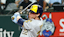 Milwaukee Brewers designated hitter Christian Yelich (22) hits an rbi single during the fifth inning against the Texas Rangers at Globe Life Field.