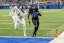 Detroit Lions running back Jahmyr Gibbs (26) runs with the ball in front of Minnesota Vikings safety Camryn Bynum (24) and scores a touchdown during the second half at Ford Field. Mandatory Credit: David Reginek-Imagn Images