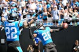 Carolina Panthers cornerback Chau Smith-Wade (26) celebrates with safety Lathan Ransom (22) after intercepting the ball and scoring a touchdown in the third quarter at Bank of America Stadium. Bob Donnan-Imagn Images