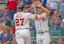 Atlanta Braves teammates Austin Riley and Matt Olson celebrate at home plate in MLB action.