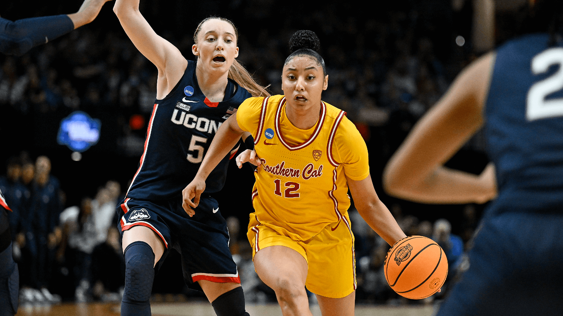 USC Trojans guard JuJu Watkins (12) drives to the basket during the second half against UConn Huskies guard Paige Bueckers (5).