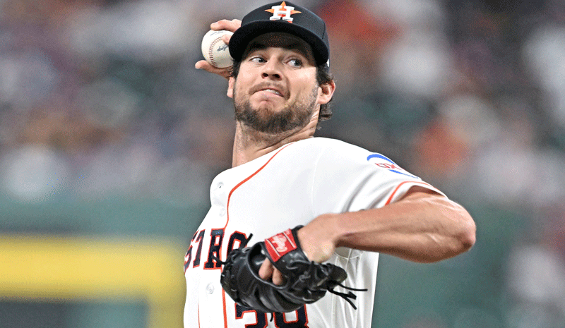 Peter Lambert (38) delivers a pitch.