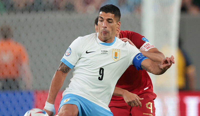 Uruguay forward Luis Suarez (9) plays the ball in front of Bolivia defender Luis Haquin (4) during the second half of the Copa America match at MetLife Stadium. Mandatory Credit: Vincent Carchietta-USA TODAY Sports