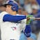 Toronto Blue Jays right fielder George Springer (4) hits a double against the Los Angeles Dodgers in the first inning during game two of the 2025 MLB World Series at Rogers Centre.