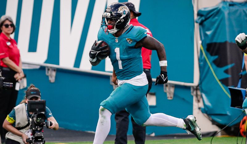 Jacksonville Jaguars running back Travis Etienne Jr. (1) runs for a touchdown.