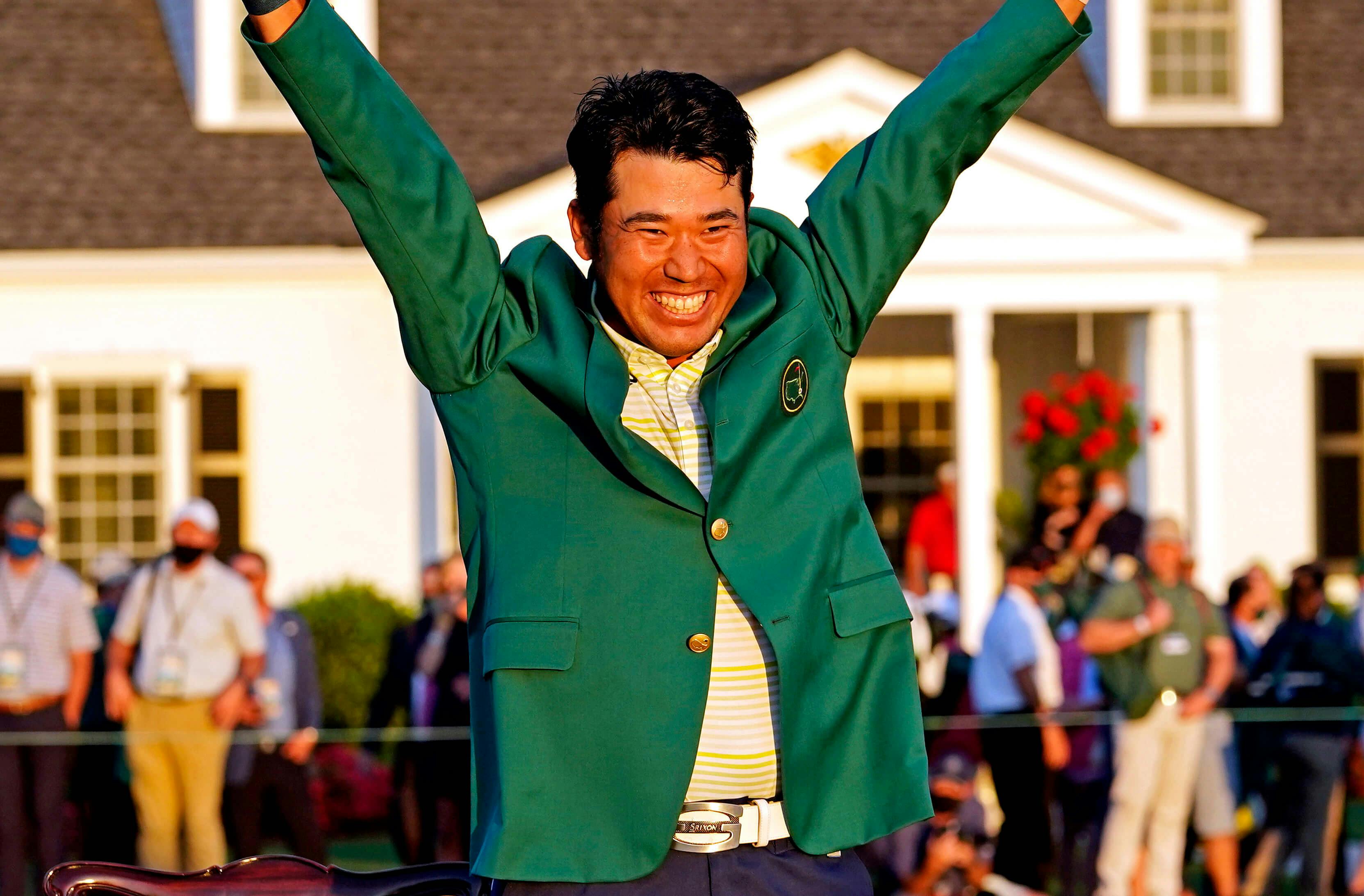 Hideki Matsuyama celebrates with the green jacket after winning The Masters golf tournament. -  USA TODAY Sports