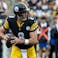 Pittsburgh Steelers quarterback Aaron Rodgers (8) looks to complete a pass.