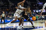 Missouri Tigers forward Mark Mitchell (25) works against Notre Dame Fighting Irish forward Kebba Njie (14) during the second half at Purcell Pavilion at the Joyce Center. Michael Caterina-Imagn Images