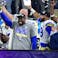 Los Angeles Rams outside linebacker Von Miller (40) hoist the Lombardi Trophy after a victory against the Cincinnati Bengals in Super Bowl LVI at SoFi Stadium.