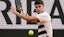 Carlos Alcaraz of Spain returns a shot during his match against Ben Shelton of the United States.