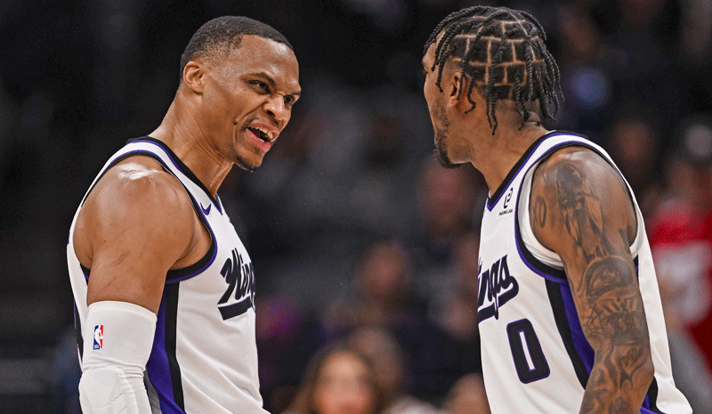 Sacramento Kings guard Russell Westbrook (18) and guard Malik Monk (0) react after Monk scores a three point basket during the fourth quarter at Golden 1 Center.