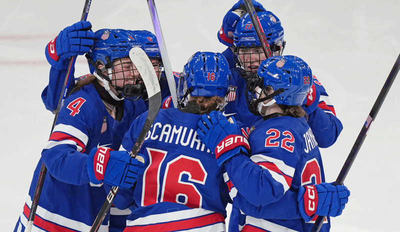 Hayley Scamurra (16) of Team United States celebrates after scoring a goal against Team Czechia in women's ice hockey Group A play during the Milano Cortina 2026 Olympic Winter Games