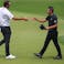 Scottie Scheffler (left) shakes hands with Collin Morikawa after they both finished the second round of the PGA Championship golf tournament at Southern Hills Country Club.