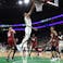 Boston Celtics forward Jayson Tatum (0) lays the ball in the basket past Miami Heat forward Caleb Martin (16) during the second half in game one of the first round for the 2024 NBA playoffs at TD Garden.