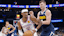 Oklahoma City Thunder guard Shai Gilgeous-Alexander (2) moves the ball around Denver Nuggets guard Christian Braun (0).