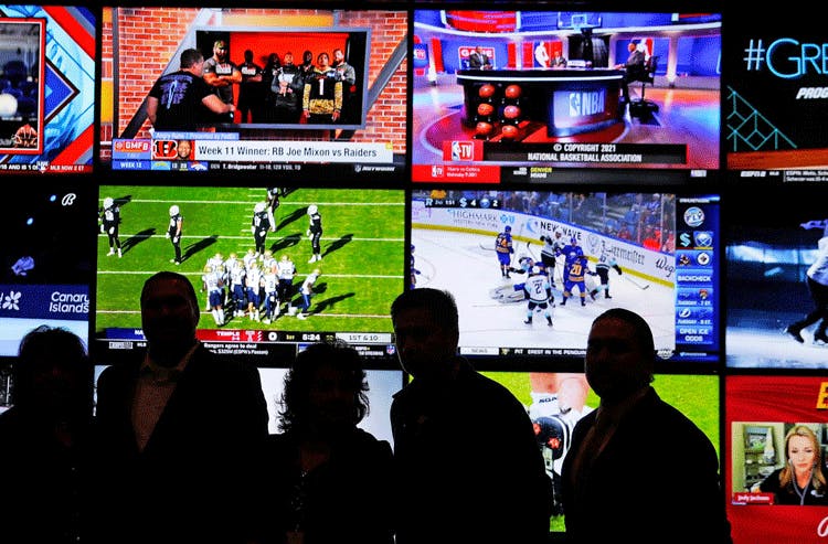 Pro sports games being broadcast in a bar