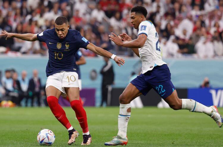 France forward Kylian Mbapp (10) controls the ball in front of England midfielder Jude Bellingham
