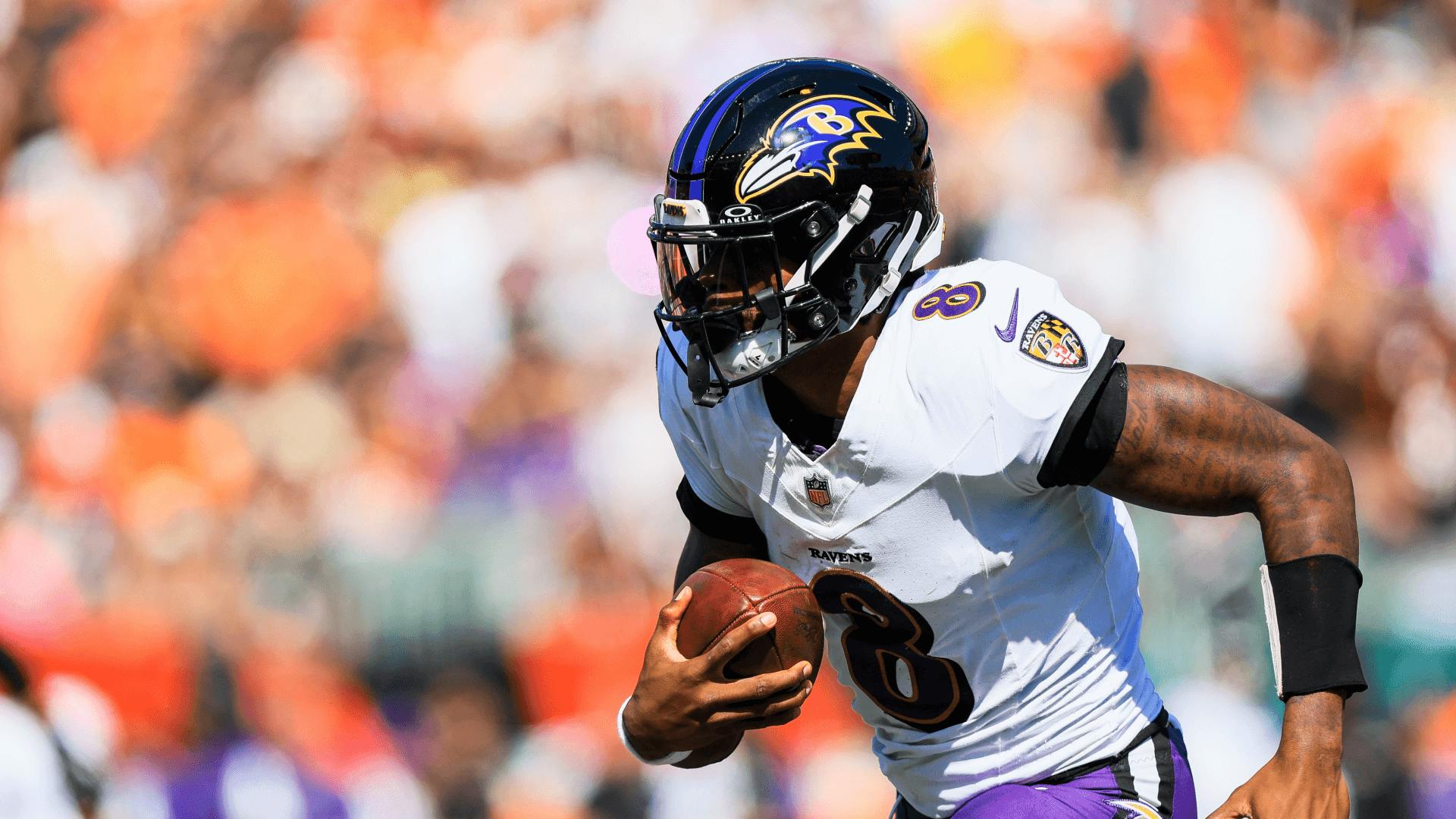 Baltimore Ravens quarterback Lamar Jackson runs with the ball against the Cincinnati Bengals.