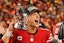 San Francisco 49ers quarterback Brock Purdy (13) holds the George Halas Trophy while after winning the NFC Championship football game against the Detroit Lions at Levi's Stadium.