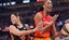 Los Angeles Sparks's Kelsey Plum (10) guards Las Vegas Aces' A’ja Wilson (22).